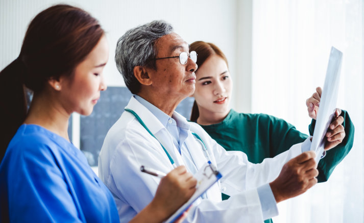 asian doctors team diagnose patient x ray radiography film, asian medical concept